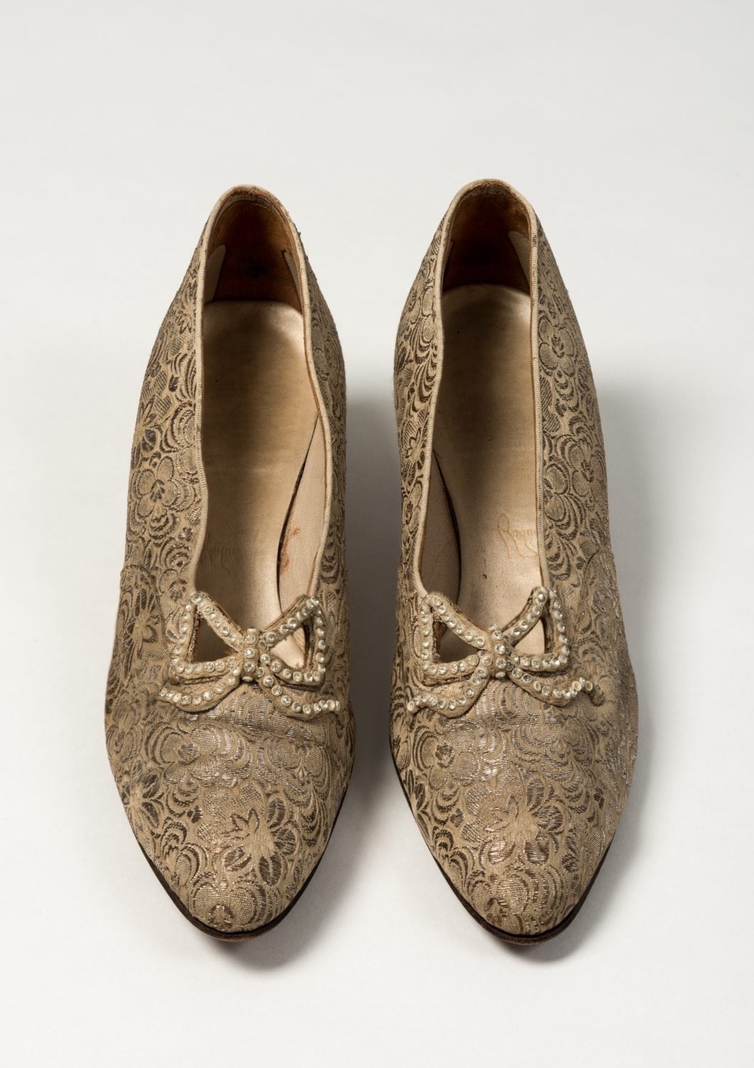 Hand embroided shoes apart of the royal school of needlework collection